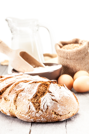 Photo of wheat bread over wooden tableの写真素材