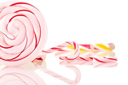 Photo of colorful candies over white isolated backgroundの写真素材