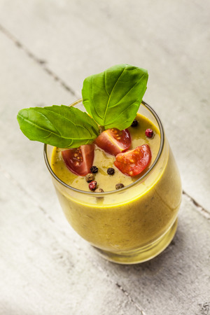 Photo of gazpacho over wooden tableの写真素材