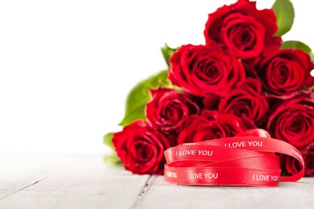 Photo of bouquet of red roses and ribbonの写真素材