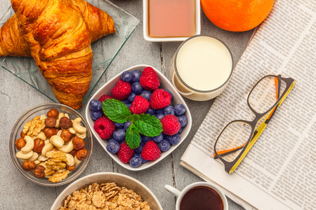 Top view of breakfast meal over wooden table