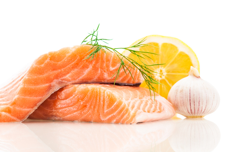 Photo of fresh tasty salmon over white isolated backgroundの写真素材