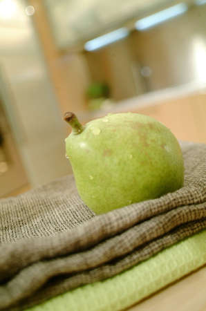 green pear on kitchenの写真素材
