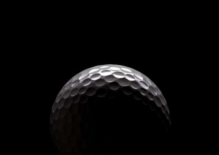 golf ball on blackの写真素材