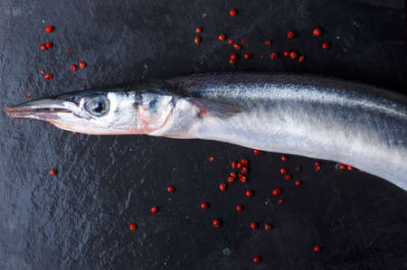 Fresh fish on black backgroundの写真素材