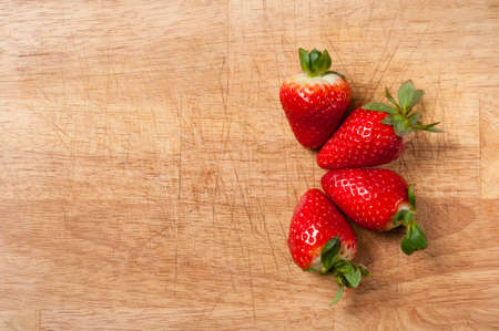Strawberry on cutting boardの写真素材
