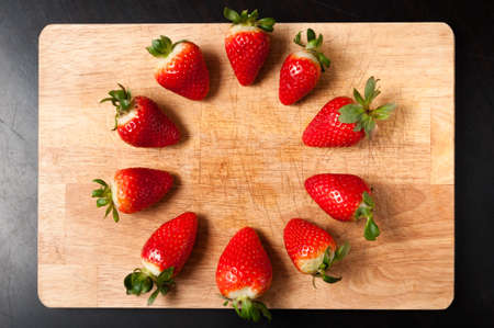 Strawberry on cutting boardの写真素材
