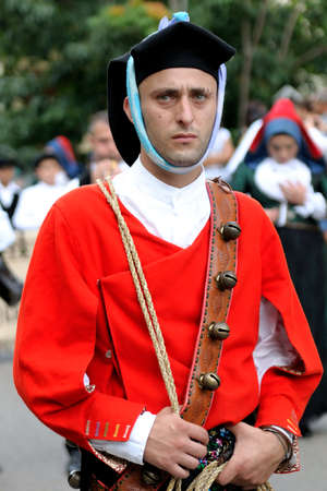 Parade of traditional costumes and masks of Sardinia Jerzu at the Wine Festival in 2014.