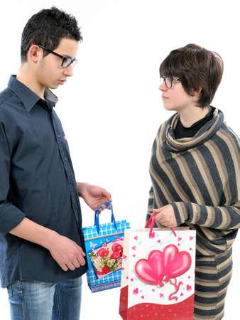 Boys who exchange gifts on Valentine's Day, the feast of love. Photo on white background.の写真素材