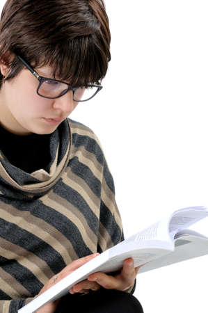 Student reading a book, photographed on white background.の写真素材