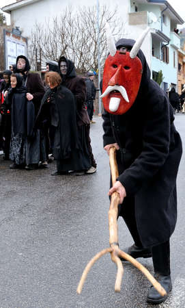 Orani, Sardinia, Italy - February 15, 2015: Parade of traditional masks of Sardinia during the Carnival 2015 in Orani.のeditorial素材