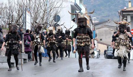 Orani, Sardinia, Italy - February 15, 2015: Parade of traditional masks of Sardinia during the Carnival 2015 in Orani.のeditorial素材