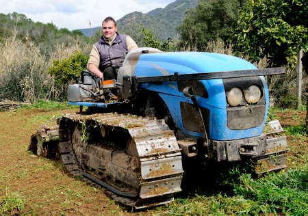 Weeding and milling of a vegetable garden with a crawler tractorの写真素材