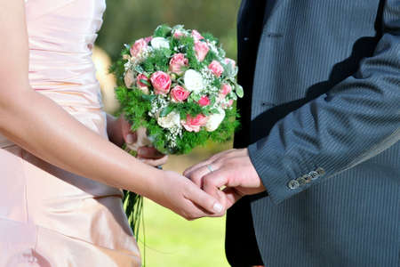 Hands of a married couple who gather with affection