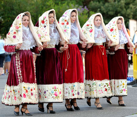 Nuoro, Sardinia, Italy - August 23, 2015: Parade of traditional costumes of Sardinia on the occasion of the Feast of the Redeemer of the Aug. 23, 2015 in Nuoro, Sardinia.のeditorial素材