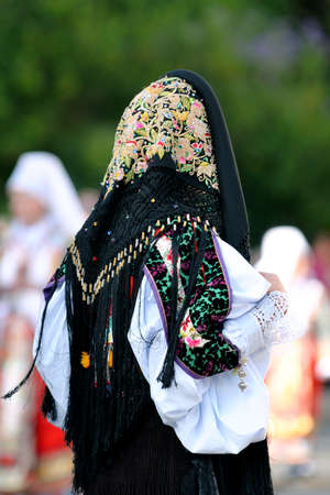 Nuoro, Sardinia, Italy - August 23, 2015: Parade of traditional costumes of Sardinia on the occasion...
