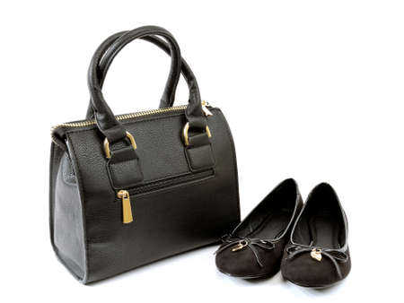 Ballerina shoes without heels and handbag photographed on white background.の写真素材