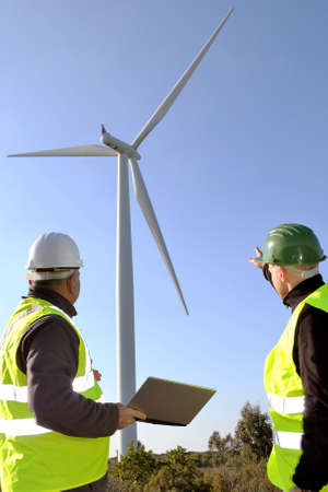 Technicians engaged in the detecting of a wind turbine installation for the production of energy