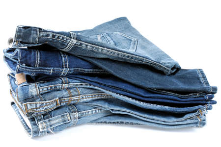 Various models of jeans for men stacked up and photographed in the studioの写真素材