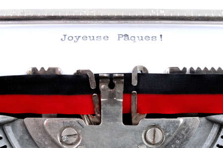 Text Happy Easter written in the French language with an old typewriter, horizontal photoの写真素材