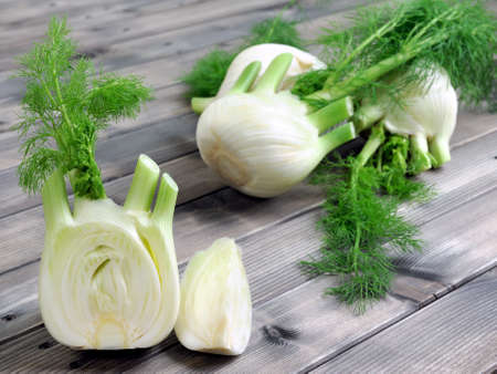 Fresh fennel cut just harvested, photographed on wooden tableの写真素材