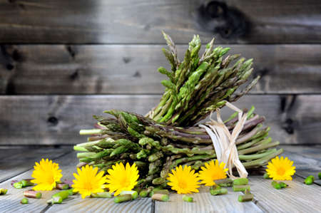 Fresh asparagus natural collected in countryside, photographed on an old wood table.の写真素材