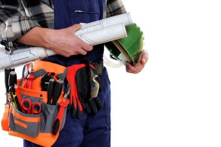Young electrician technician with project and protective helmet in hand isolated on white background.の写真素材