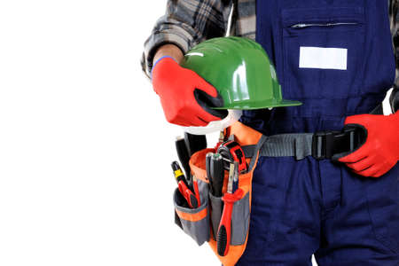 Young electrician technician wearing protective gloves and helmet in the hands isolated on white...