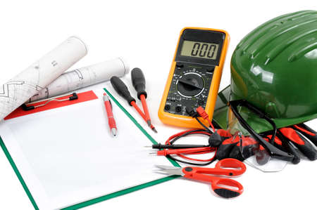 Project, notepads and tools for working on a residential electrical installation, photographed on a white background.の写真素材