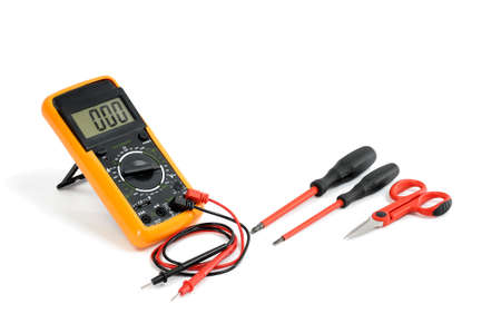 Multimeter and tools for working on a residential electrical installation, photographed on a white background.の写真素材