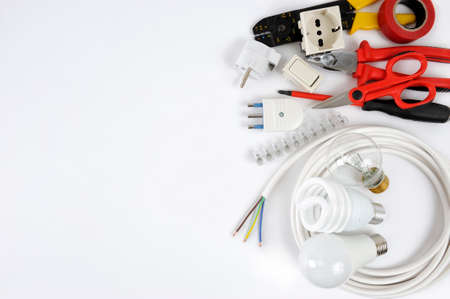 Close-up of work tools and electrical equipment on a white background with space for text  announcement.の写真素材