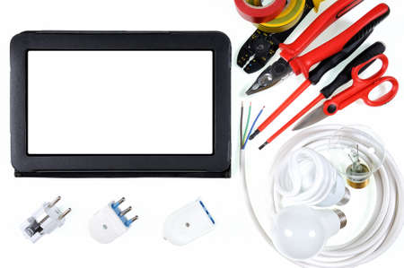 Close-up of tablet, work tools and components for a residential electrical installation,...