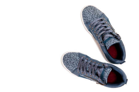Top view of girl's shoes for leisure photographed on white background.の写真素材