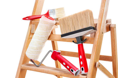 Work tools for professional house painter on a wooden ladder, isolated on white backgroundの写真素材