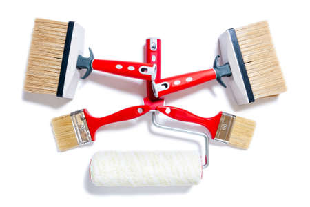 Top view of brushes and roller for professional house painter, photographed on white backgroundの写真素材
