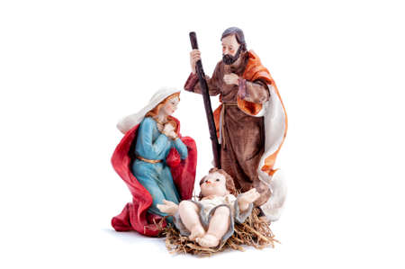 Christmas nativity scene. Baby Jesus in the manger with Mary and Joseph isolated on white background.の写真素材