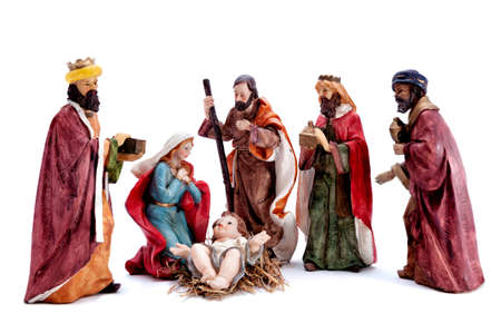 Christmas nativity scene. Baby Jesus in the manger with Mary, Joseph and the three wise men isolated on white background.の写真素材