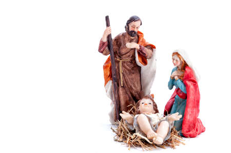 Christmas nativity scene. Baby Jesus in the manger with Mary and Joseph isolated on white background.の写真素材