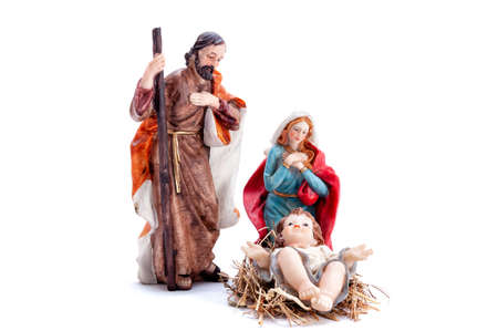 Christmas nativity scene. Baby Jesus in the manger with Mary and Joseph isolated on white background.の写真素材
