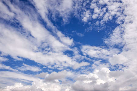 Landscape of a beautiful blue sky covered with cumulonimbus clouds on a warm summer afternoonの写真素材
