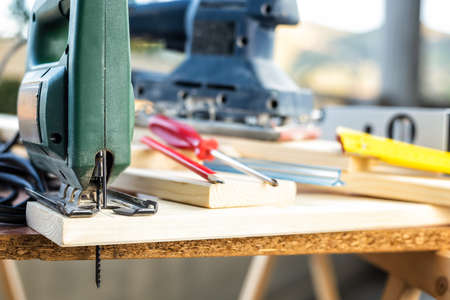 Professional woodworking tools, manual electric saw for cutting wood. Housework do it yourself....