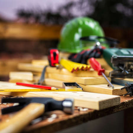 Carpenter's square, carpentry tools on a work table. Construction industry, housework do it yourself. Stock photography.の写真素材