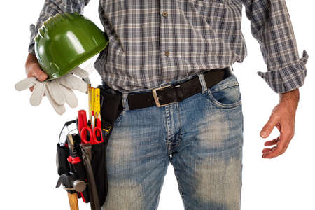Adult craftsman carpenter isolated on white background, he is holding his helmet and leather work gloves. Work tools industry construction, do it yourself housework. Stock photography.の写真素材