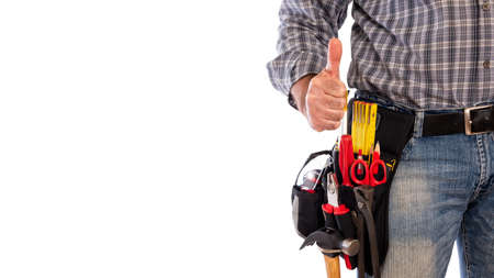 Adult craftsman carpenter isolated on white background making ok sign with thumb up. Work tools industry construction, do it yourself housework. Stock photography.の写真素材