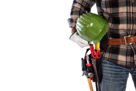 Adult craftsman carpenter isolated on white background, he wears leather work gloves and holds a...