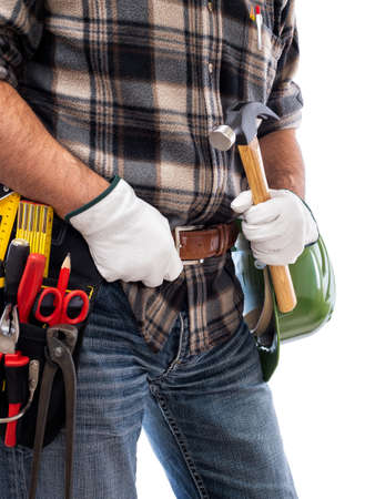 Adult craftsman carpenter isolated on white background; he wears leather work gloves, he is holding a carpenterâs hammer. Work tools industry construction and do it yourself housework. Stock photography.の写真素材