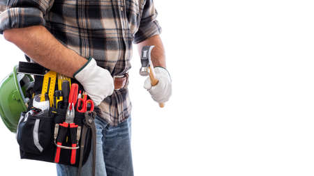 Carpenter isolated on white background, he wears leather work gloves and is holding a carpenter's hammer. Work tools industry construction and do it yourself housework. Stock photography.の写真素材