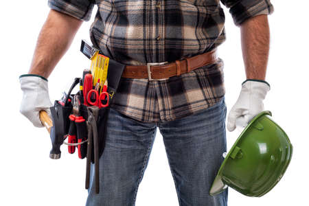 Carpenter isolated on white background, he wears leather work gloves, he is holding a...