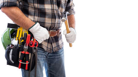 Carpenter isolated on white background, he wears leather work gloves and is holding a carpenter's hammer. Work tools industry construction and do it yourself housework. Stock photography.の写真素材