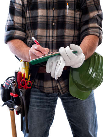 Carpenter isolated on white background writes work notes on a notebook. Work tools industry...